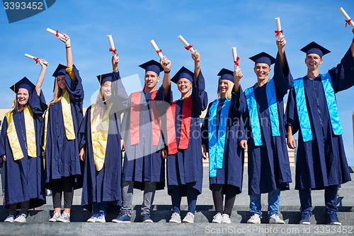 Image of young graduates students group