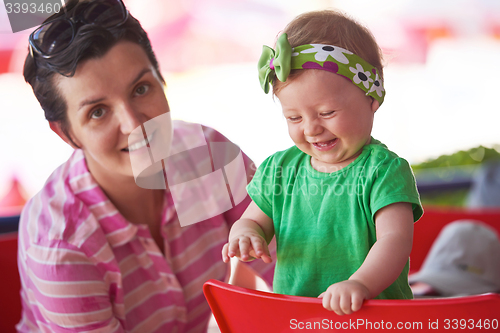 Image of portrait of happy young mother and baby