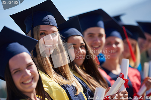 Image of young graduates students group