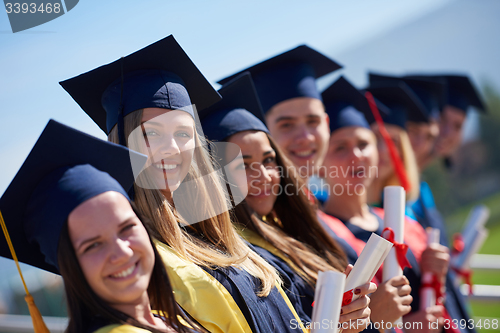 Image of young graduates students group