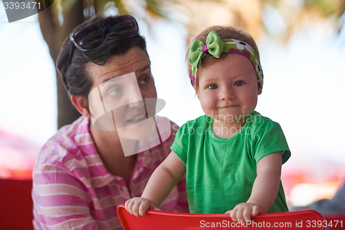 Image of portrait of happy young mother and baby