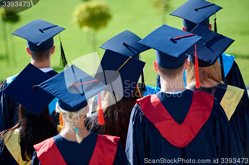 Image of young graduates students group