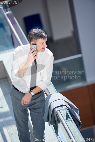 Image of business man using phone