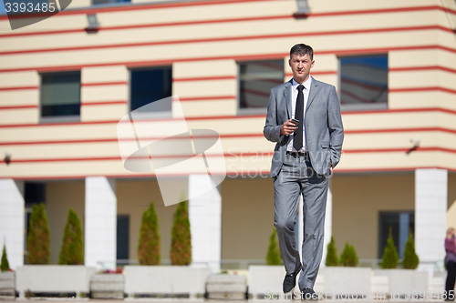 Image of senior  businessman outdoors