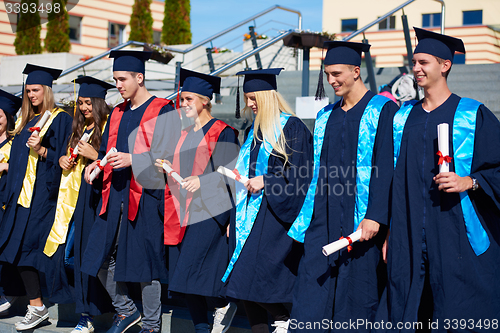 Image of young graduates students group