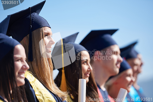 Image of young graduates students group