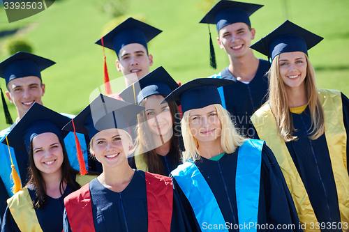 Image of young graduates students group