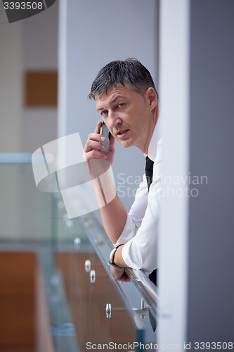 Image of business man using phone