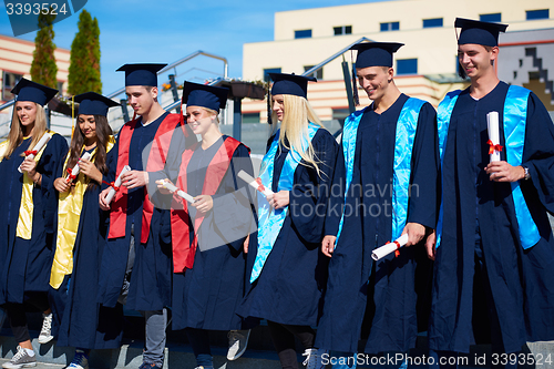 Image of young graduates students group