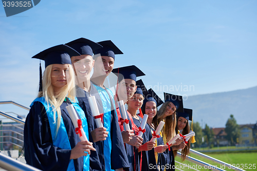 Image of young graduates students group