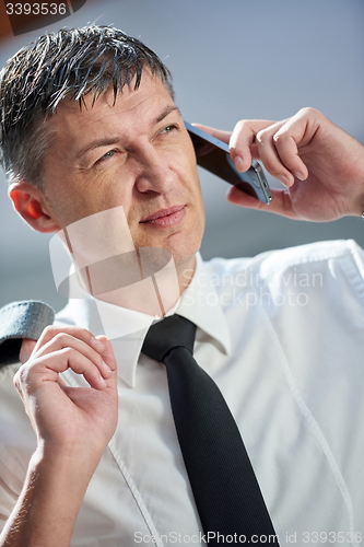 Image of business man using phone