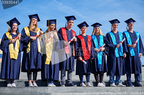 Image of young graduates students group