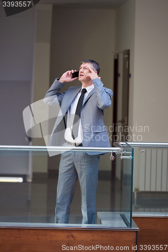 Image of business man using phone