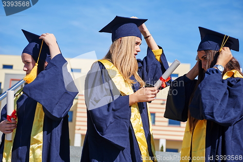 Image of young graduates students group