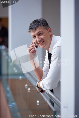 Image of business man using phone