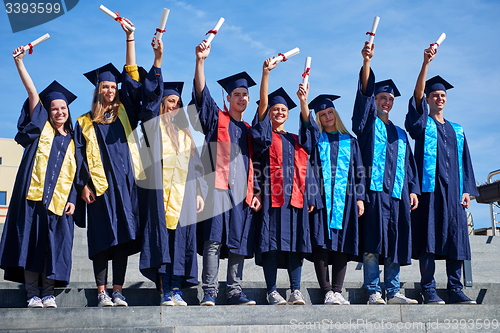 Image of young graduates students group