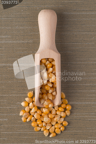 Image of Wooden scoop with corn