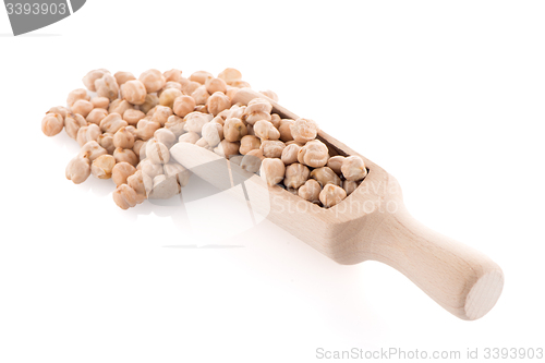 Image of Uncooked chickpeas and wooden scoop