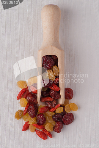 Image of Wooden scoop with mixed dried fruits