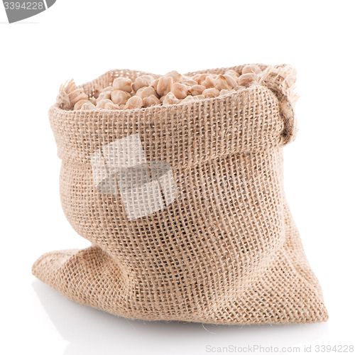 Image of Uncooked chickpeas on burlap bag