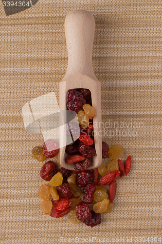 Image of Wooden scoop with mixed dried fruits