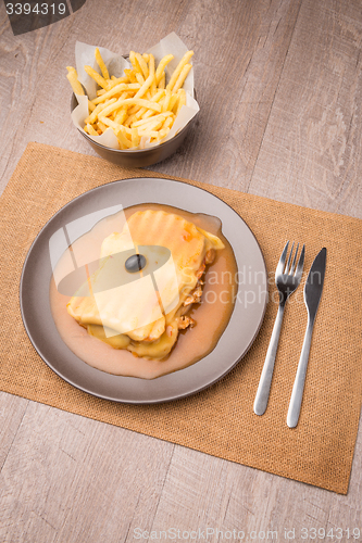 Image of Francesinha and french fries