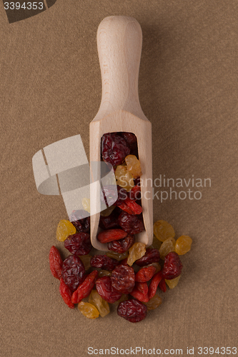 Image of Wooden scoop with mixed dried fruits