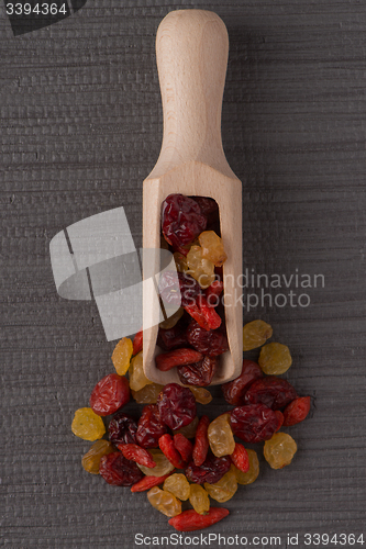 Image of Wooden scoop with mixed dried fruits