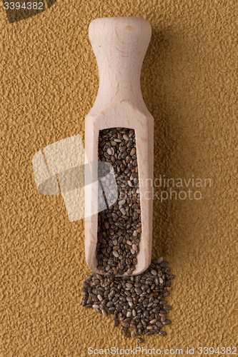 Image of Wooden scoop with chia seeds