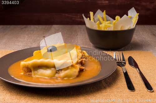 Image of Francesinha and french fries