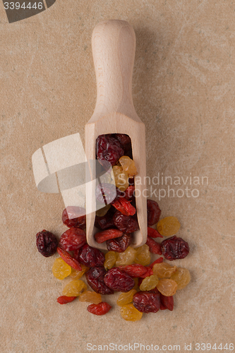 Image of Wooden scoop with mixed dried fruits