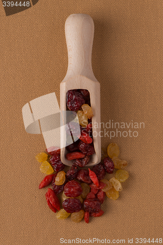 Image of Wooden scoop with mixed dried fruits