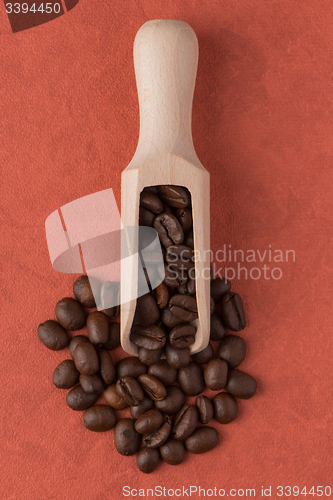 Image of Wooden scoop with coffee beans