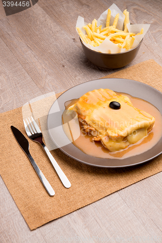Image of Francesinha and french fries