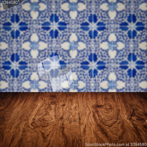 Image of Wood table top and blur vintage ceramic tile pattern wall