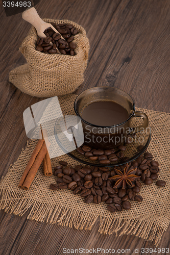 Image of Coffee cup with burlap sack
