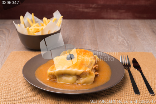 Image of Francesinha and french fries