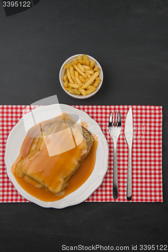 Image of Francesinha and french fries