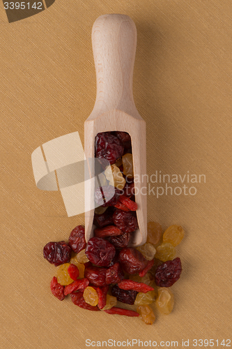 Image of Wooden scoop with mixed dried fruits