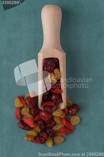 Image of Wooden scoop with mixed dried fruits