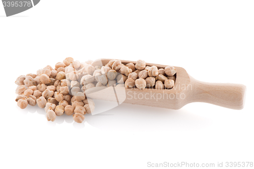 Image of Uncooked chickpeas and wooden scoop