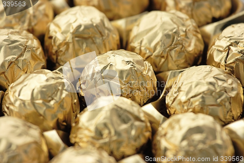 Image of Chocolate sweets in golden foil