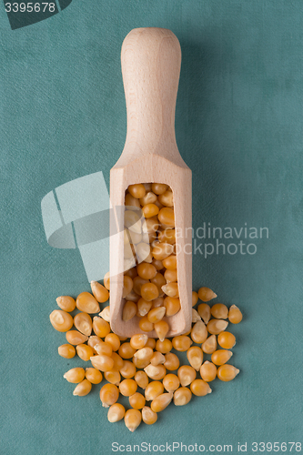 Image of Wooden scoop with corn
