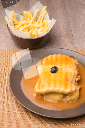 Image of Francesinha and french fries