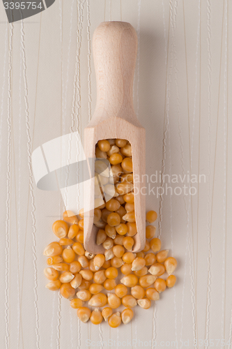 Image of Wooden scoop with corn