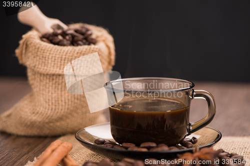 Image of Coffee cup with burlap sack