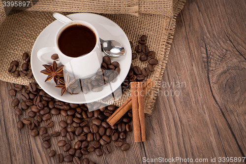 Image of Coffee cup with burlap sack