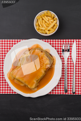 Image of Francesinha and french fries