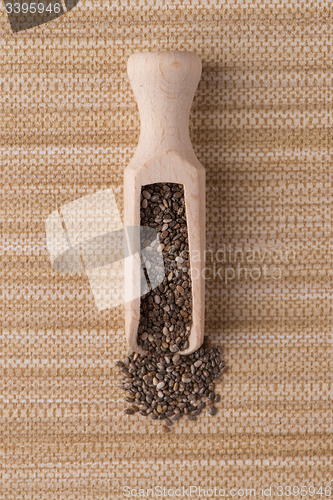 Image of Wooden scoop with chia seeds