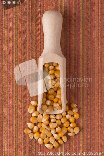 Image of Wooden scoop with corn